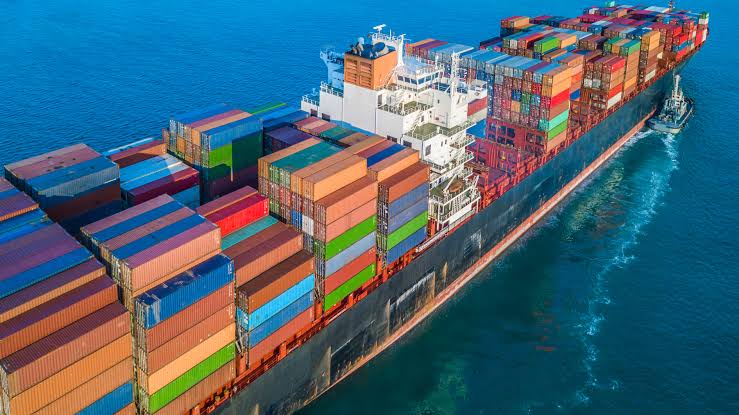 Global trade logistics — cargo ship, aircraft and port